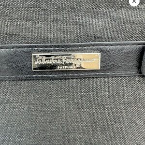 Salvatore Ferragamo, black and gray cosmetic bag.